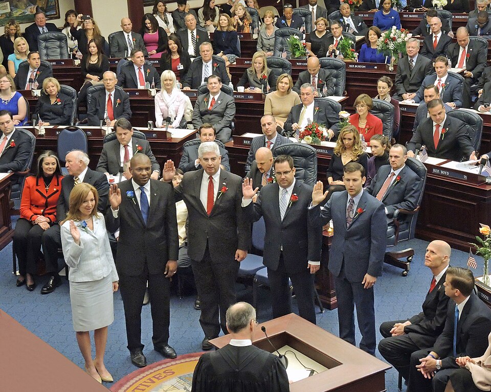 House Members Raise — Newly-elected House members raise their hands as take their oath of office from Supreme Court Justice Charles Canady