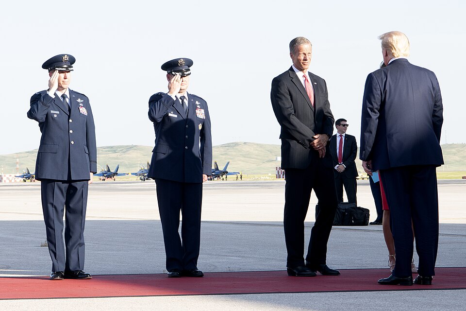 Donald Trump Is — President Donald Trump is greeted by Senator John Thune