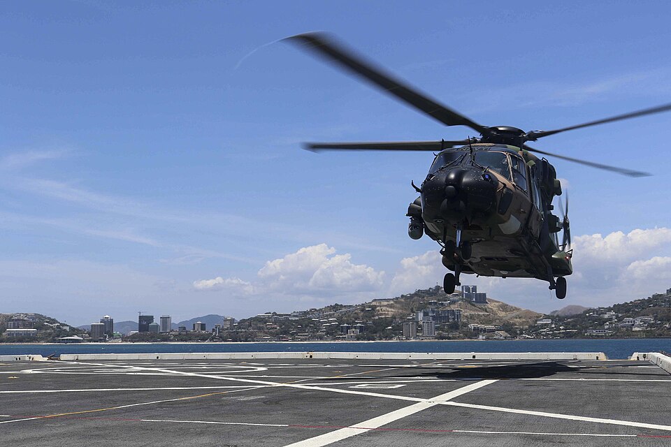 Efforts Ahead — Royal Australian Navy MRH-90 lands on the flight deck of USS Green Bay in November 2018